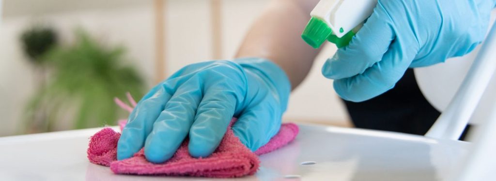 Technician Disinfecting Surface
